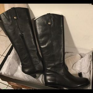 Black leather knee- high boots